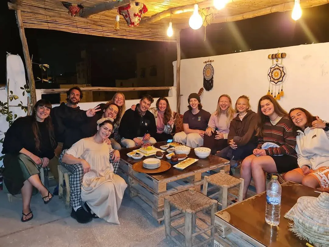 Guests enjoying community dinner at the hostel